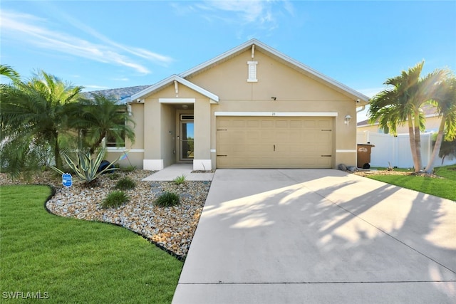 ranch-style house with a garage and a front lawn