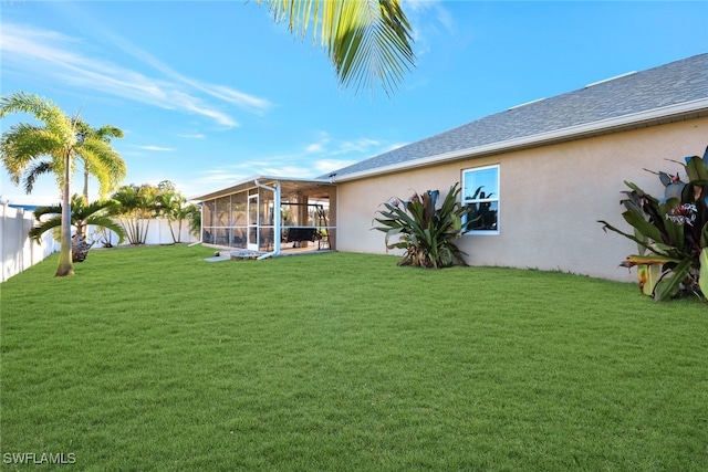 view of yard featuring a sunroom