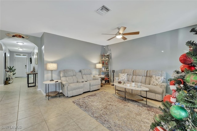 tiled living room with ceiling fan