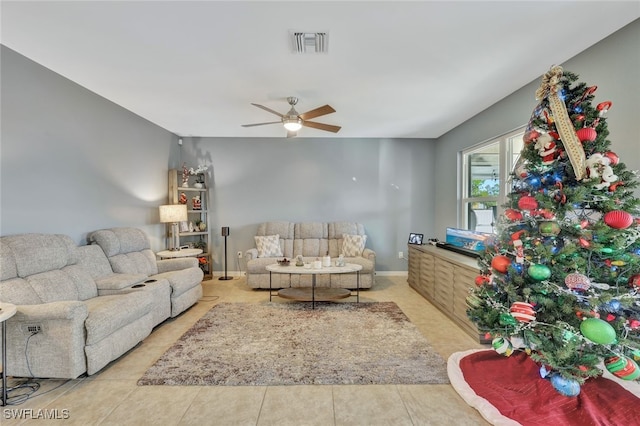 tiled living room with ceiling fan