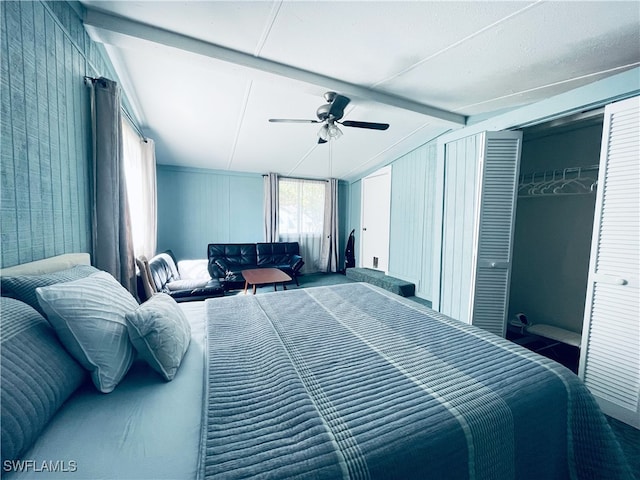 bedroom with vaulted ceiling with beams and ceiling fan