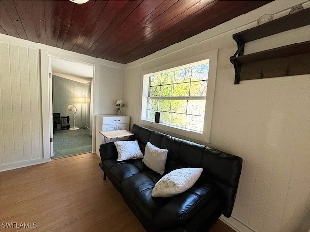 living room featuring wood ceiling and light hardwood / wood-style floors