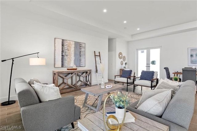 living room with french doors and light hardwood / wood-style flooring