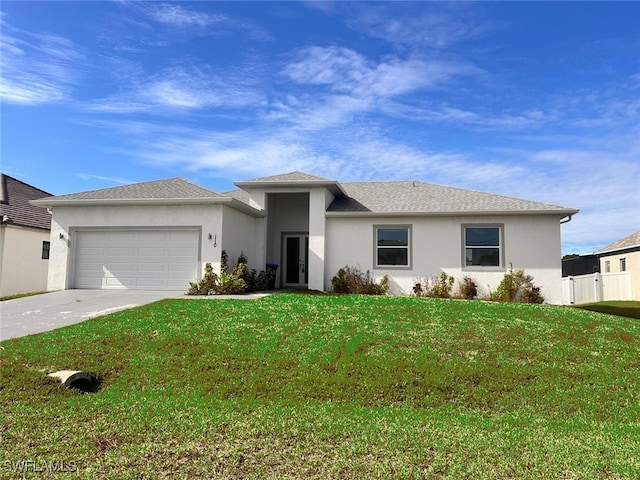 view of front facade featuring a front yard and a garage