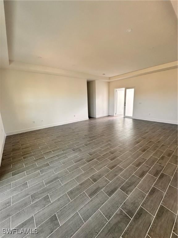 empty room featuring dark hardwood / wood-style floors