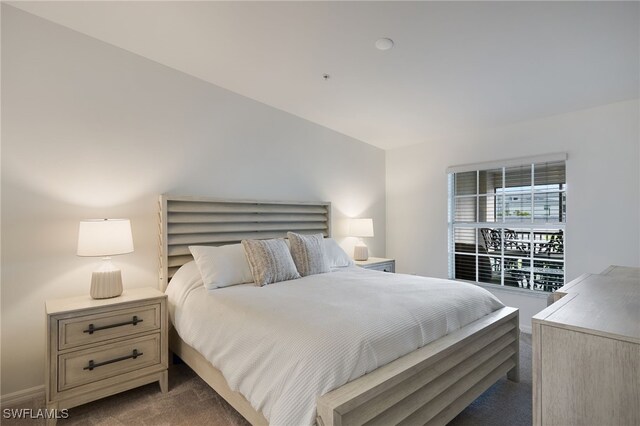 bedroom featuring dark colored carpet