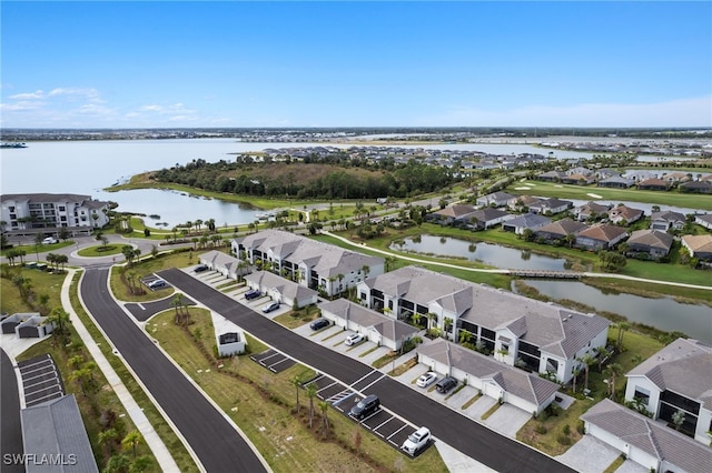 birds eye view of property with a water view