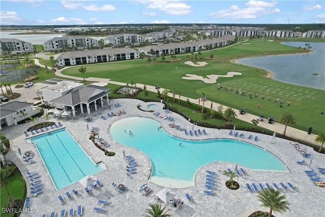 view of pool featuring a water view and a patio area