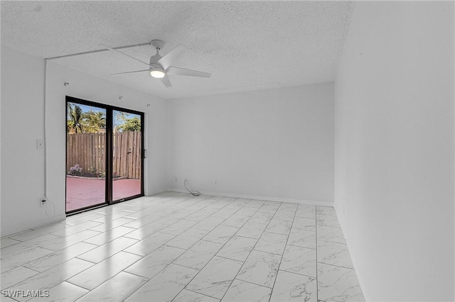 spare room featuring ceiling fan and a textured ceiling