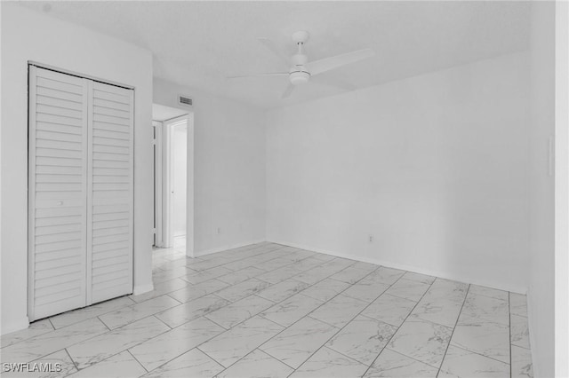 empty room featuring ceiling fan