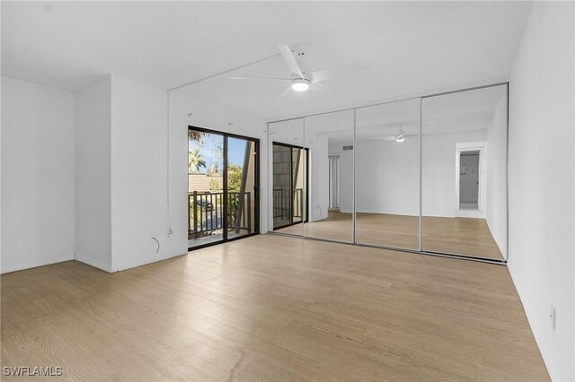 interior space with access to outside, ceiling fan, a closet, and light hardwood / wood-style floors