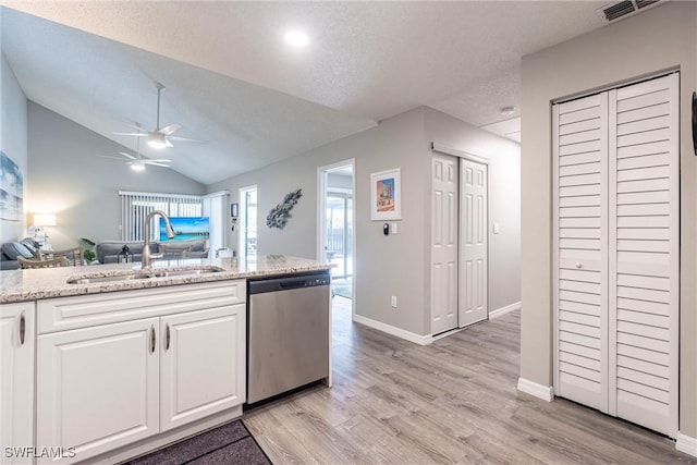 kitchen with a ceiling fan, visible vents, a sink, stainless steel dishwasher, and open floor plan