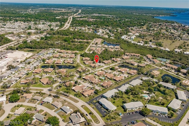 aerial view featuring a residential view and a water view