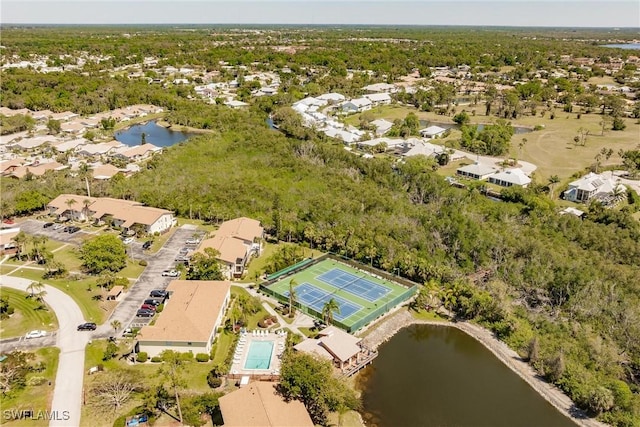 drone / aerial view with a water view and a residential view