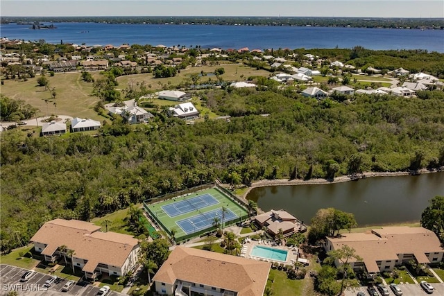 drone / aerial view with a residential view and a water view