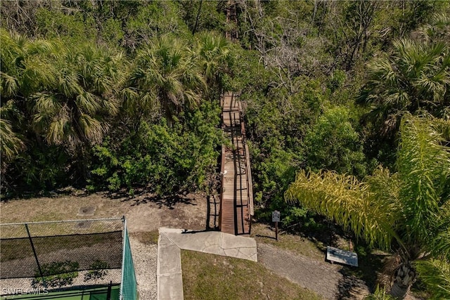 view of property's community with fence