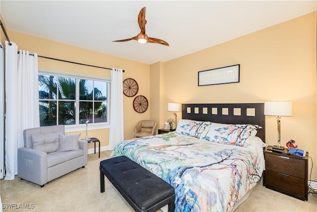 bedroom with light colored carpet and ceiling fan