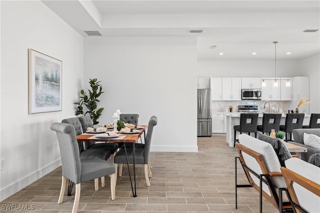 dining area featuring light wood-type flooring