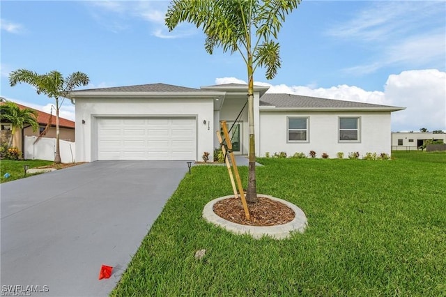 view of front of property featuring a front lawn and a garage