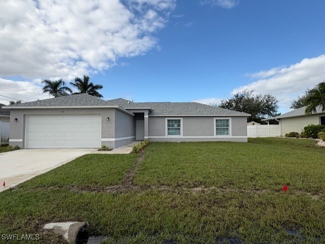 single story home featuring a garage and a front yard