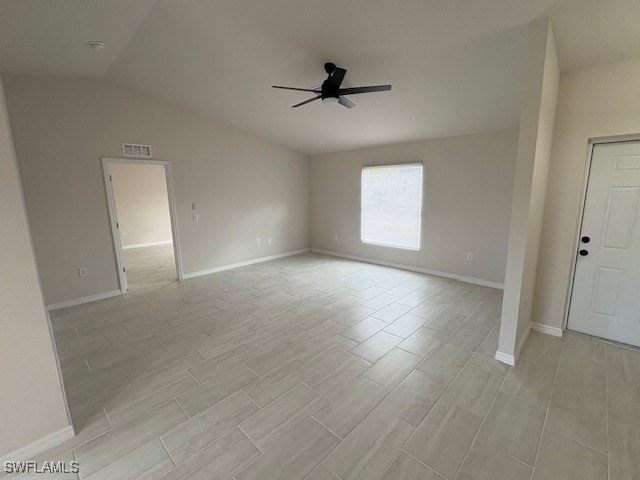 spare room with vaulted ceiling and ceiling fan