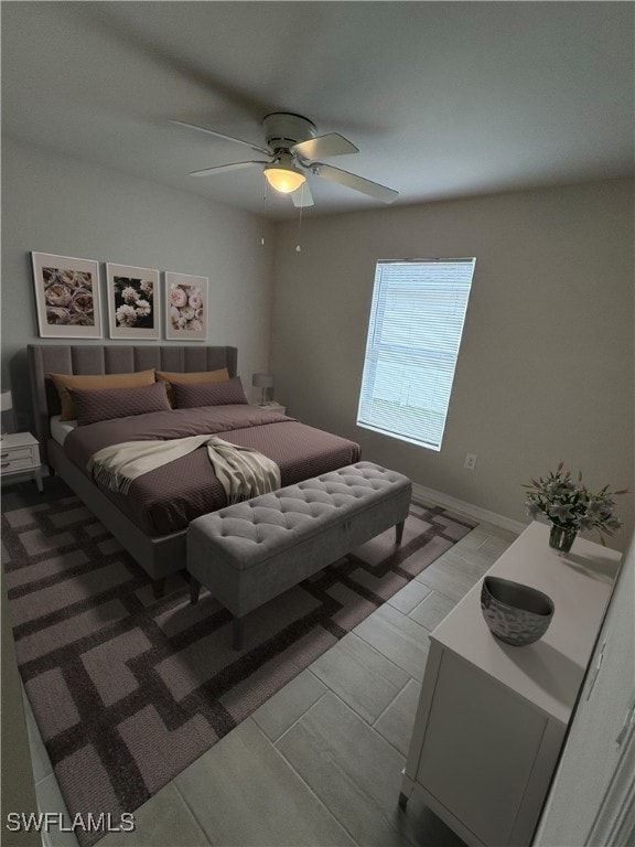 bedroom featuring light hardwood / wood-style floors and ceiling fan