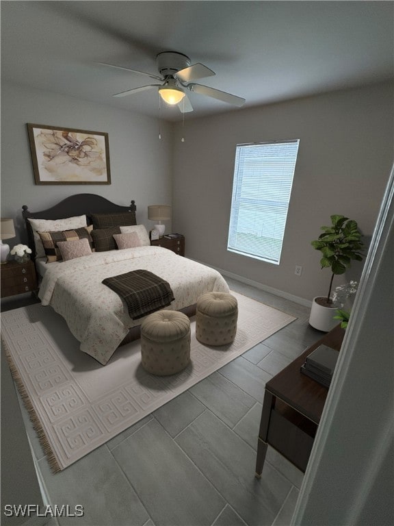 bedroom with hardwood / wood-style floors and ceiling fan