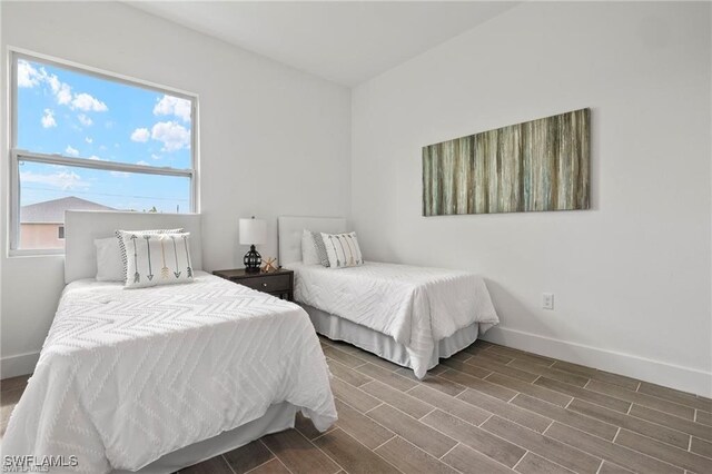 bedroom with wood-type flooring