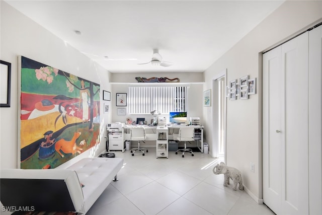 home office with light tile patterned flooring and a ceiling fan