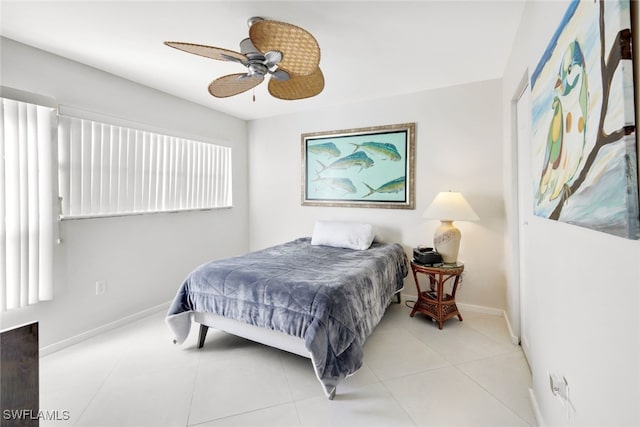 bedroom featuring light tile patterned floors and ceiling fan