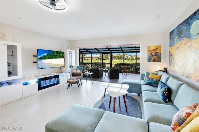 tiled living room with ceiling fan