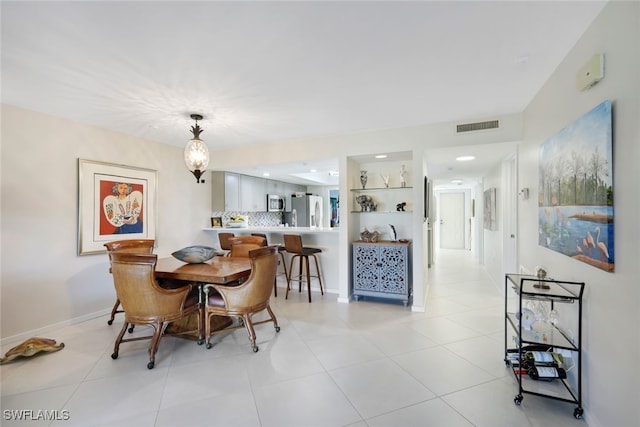 dining space with light tile patterned flooring