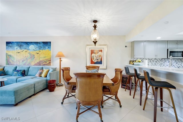 dining area with light tile patterned floors