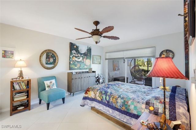 bedroom featuring ceiling fan, light tile patterned flooring, and baseboards