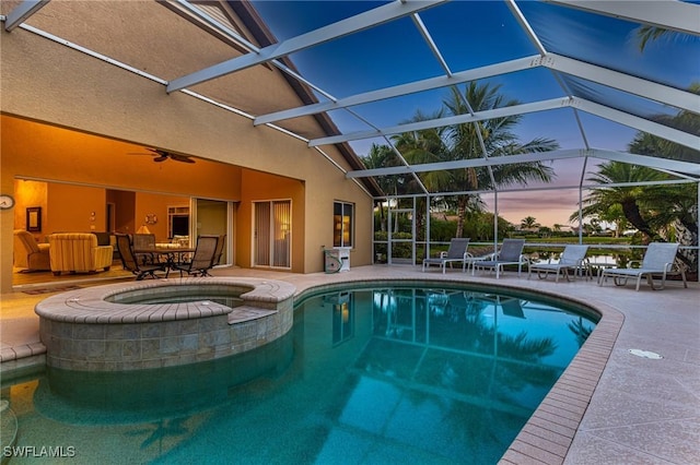 8476 Indian Wells Way, Naples, FL 34113 - pool at dusk with a lanai, a patio, and a pool with connected hot tub
