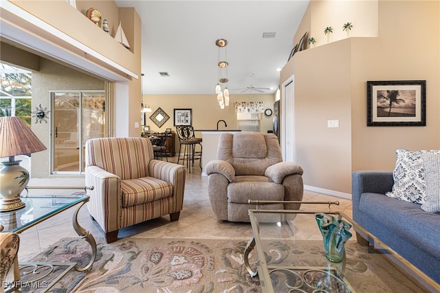 tiled living room with ceiling fan