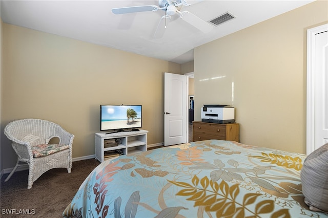 bedroom featuring dark colored carpet and ceiling fan