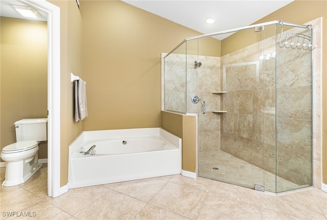 bathroom featuring tile patterned flooring, toilet, and independent shower and bath