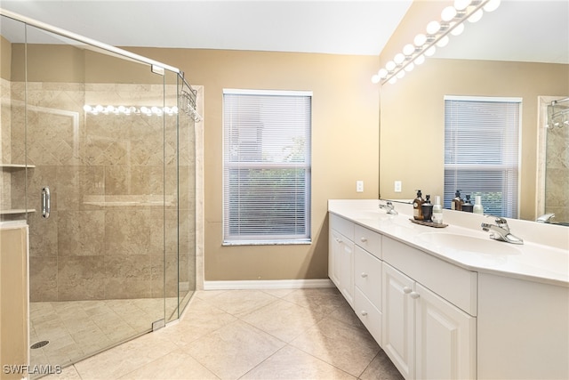 bathroom featuring vanity, tile patterned floors, and an enclosed shower