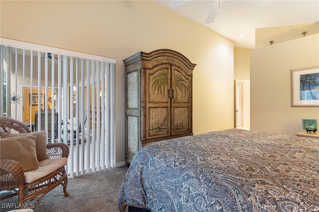 bedroom featuring dark colored carpet, multiple windows, and ceiling fan