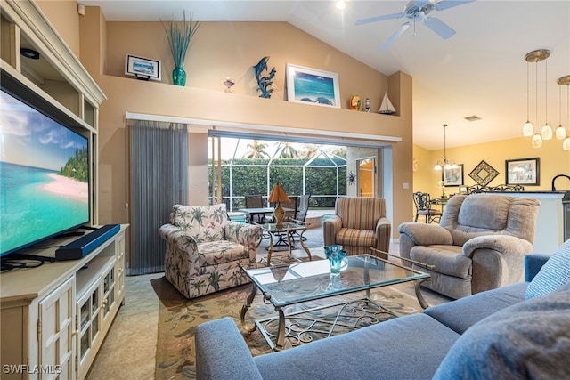 carpeted living room featuring ceiling fan with notable chandelier and high vaulted ceiling