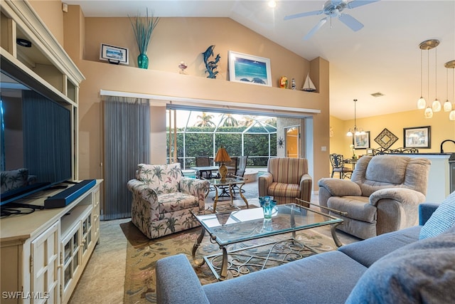 carpeted living room featuring ceiling fan with notable chandelier and high vaulted ceiling