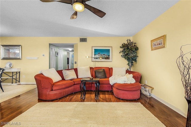 living room with ceiling fan and wood-type flooring