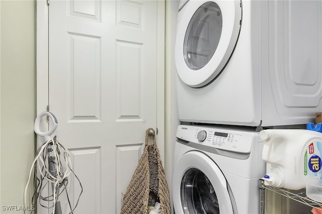 laundry area featuring stacked washer and dryer