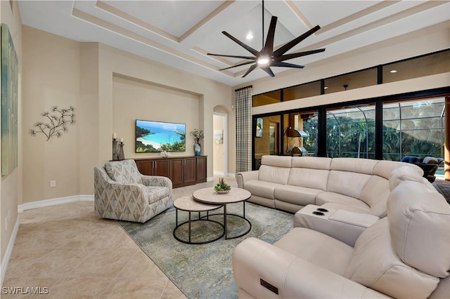 7399 Acorn Way, Naples, FL 34119 - living area featuring ceiling fan, light tile patterned flooring, coffered ceiling, baseboards, and arched walkways