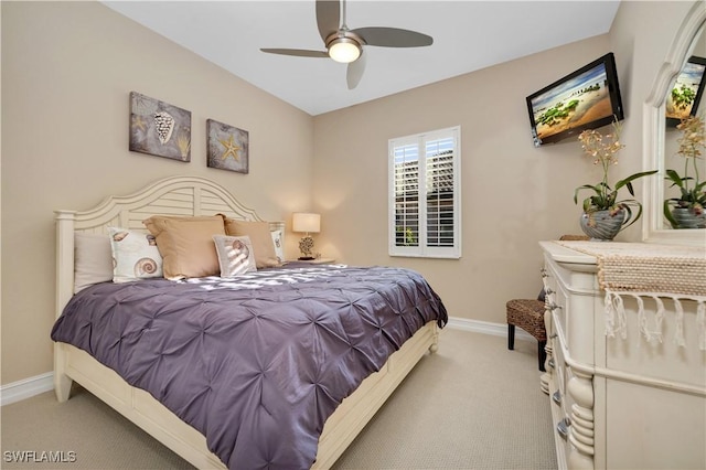 7399 Acorn Way, Naples, FL 34119 - carpeted bedroom with baseboards and ceiling fan