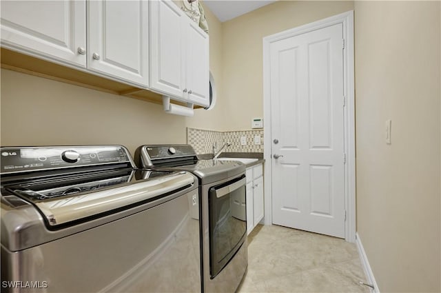 7399 Acorn Way, Naples, FL 34119 - washroom with separate washer and dryer and cabinet space