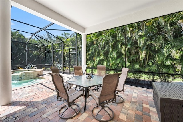 7399 Acorn Way, Naples, FL 34119 - view of patio featuring outdoor dining area, glass enclosure, and a pool with connected hot tub