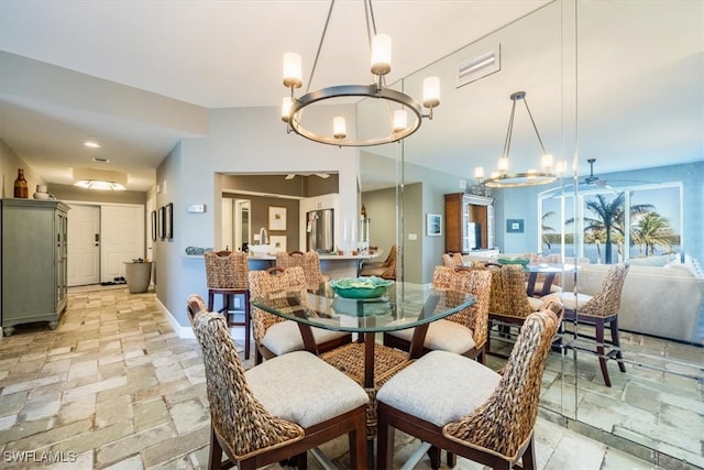 dining space featuring an inviting chandelier