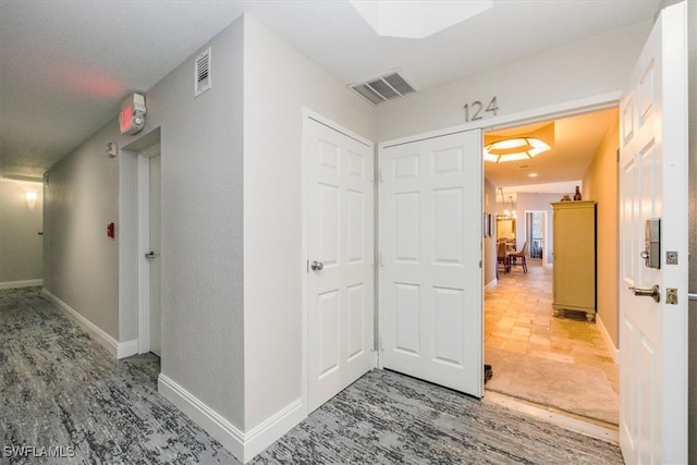 hallway with wood-type flooring